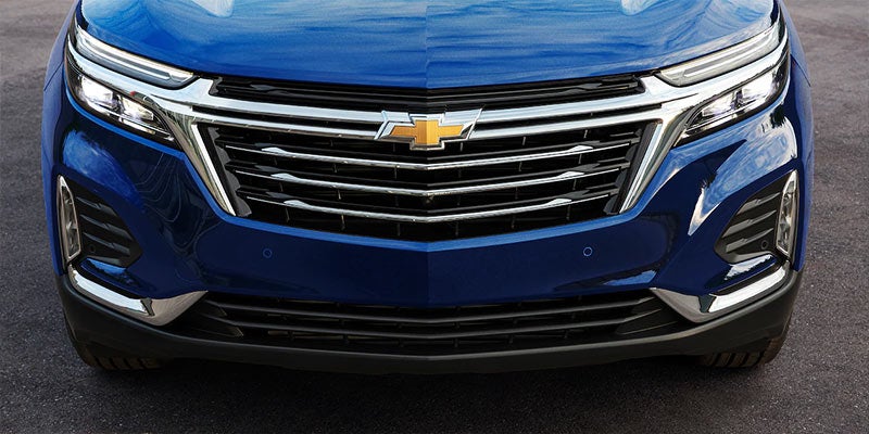 Front view of a blue Chevrolet SUV showcasing its sleek design .